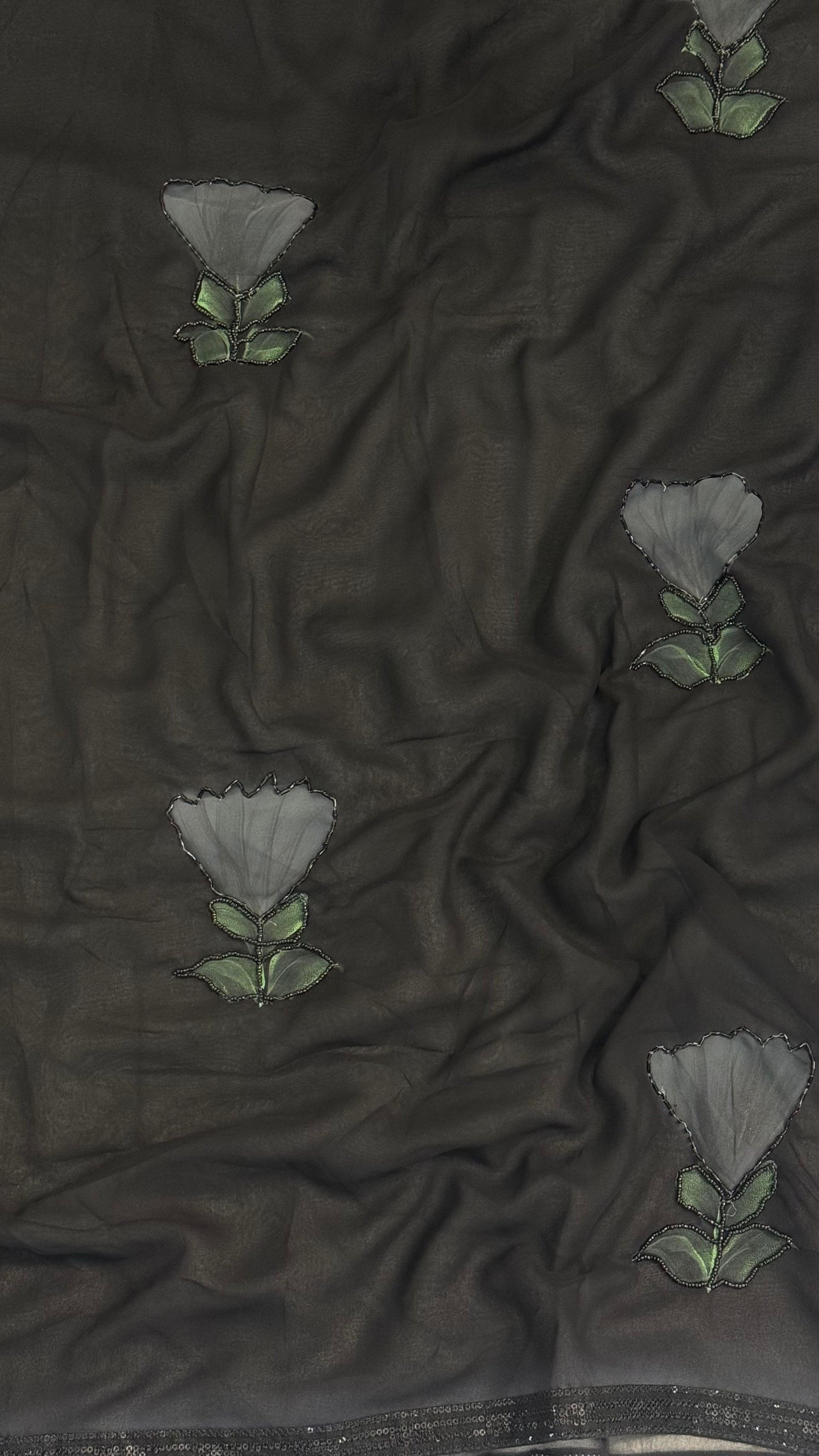 Elegant Black saree With flower pattern and Beads Work